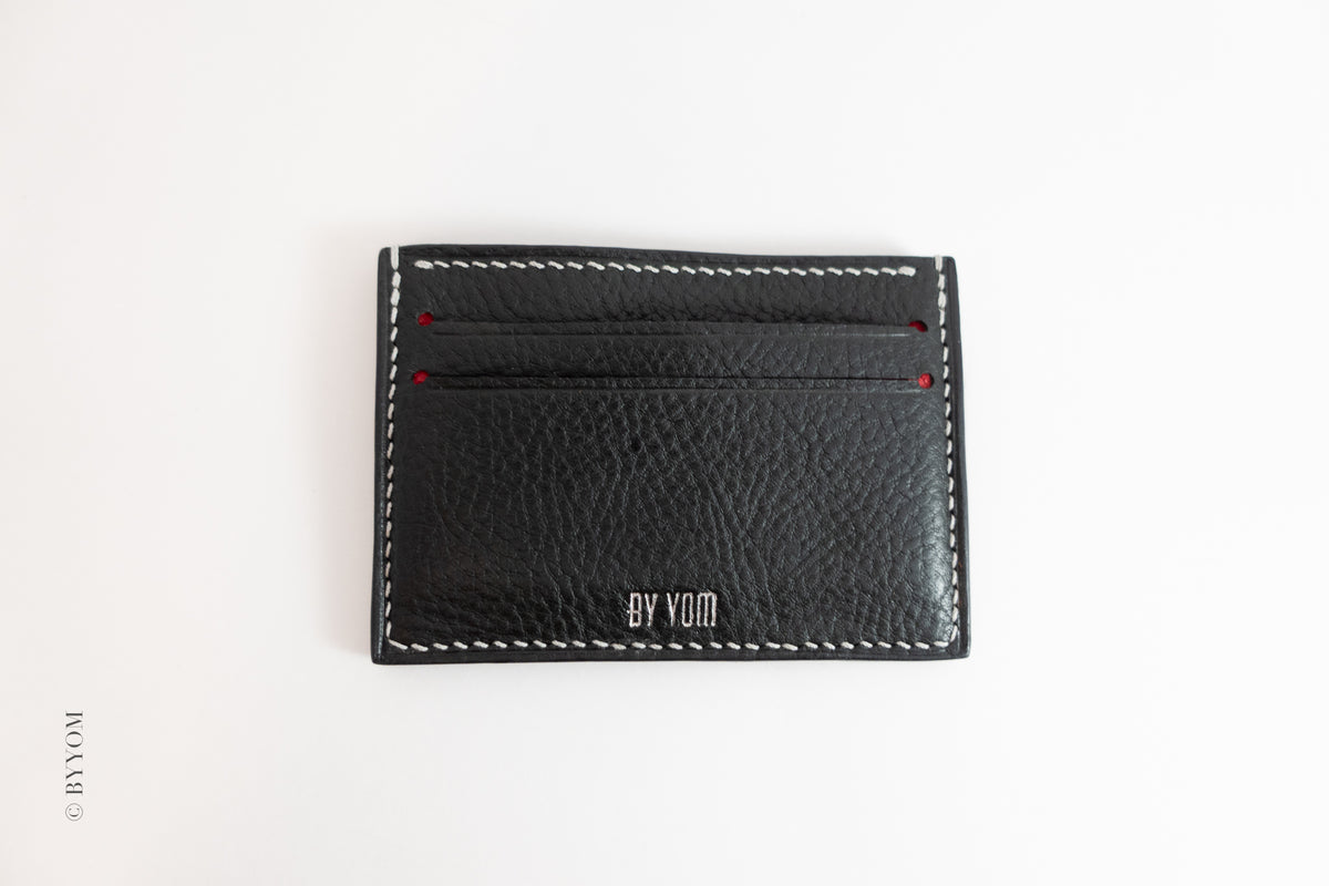 Alan goat skin cardholder with white stitch made 'BY VOM' branding on a white background